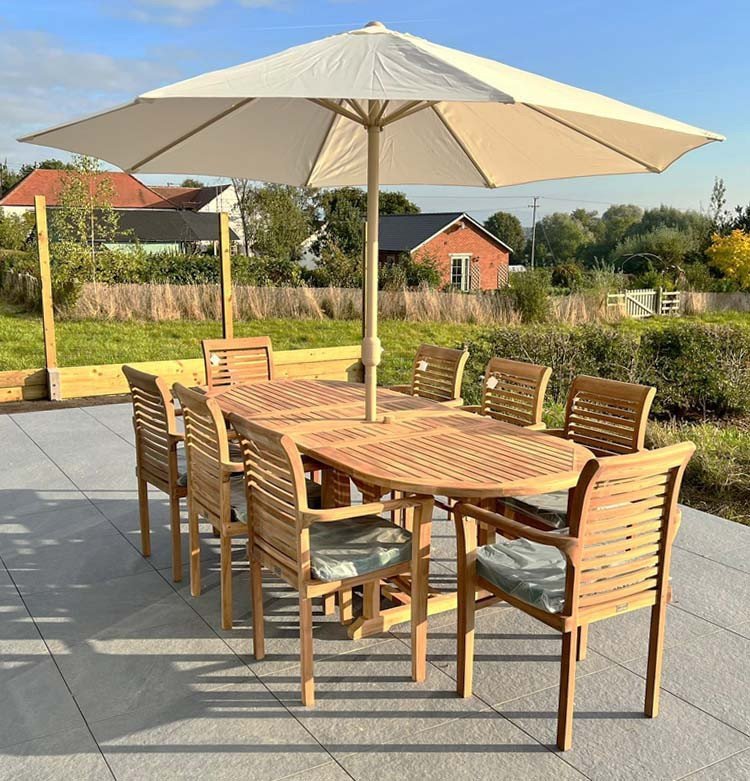 This teak garden dining set is amazing value - double extending table 1.8m to 2.4m, 8 x teak stacking chairs, free 3m parasol and cushions