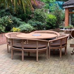 Teak garden dining table. 1.8m Titan round table with 4 bow wood style seats